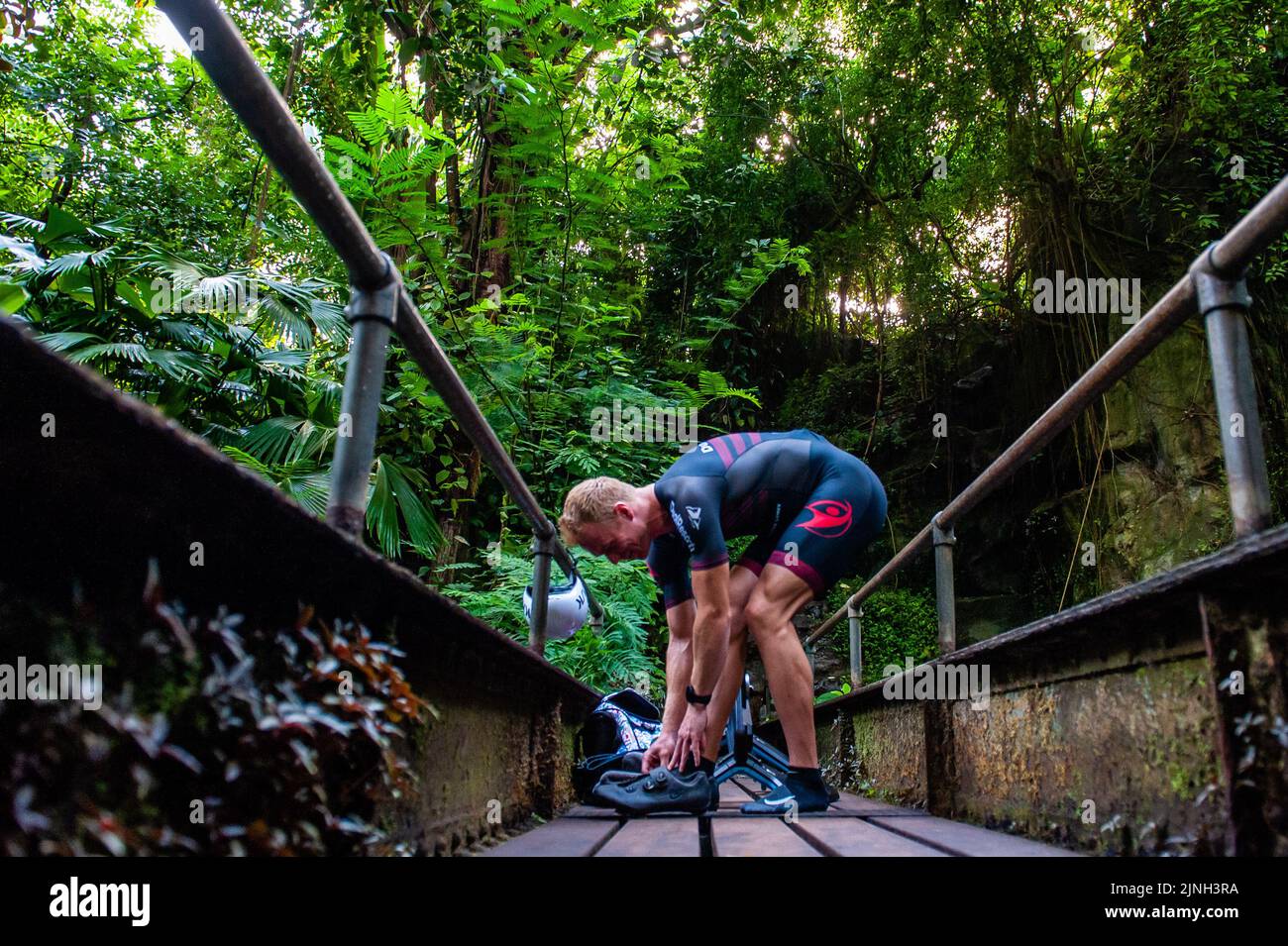 Athlete Olaf Van Den Bergh seen changing his shoes before starting training. Dutch top athlete Olaf Van Den Bergh starts training in the indoor tropical rainforest of the Burgers' Zoo in Arnhem, in preparation for the Ironman World Championships in Kailua-Kona located in Hawaii. The Bush (indoor tropical rainforest) is the ideal training location because of the high humidity and temperature. (Photo by Ana Fernandez / SOPA Images/Sipa USA) Stock Photo