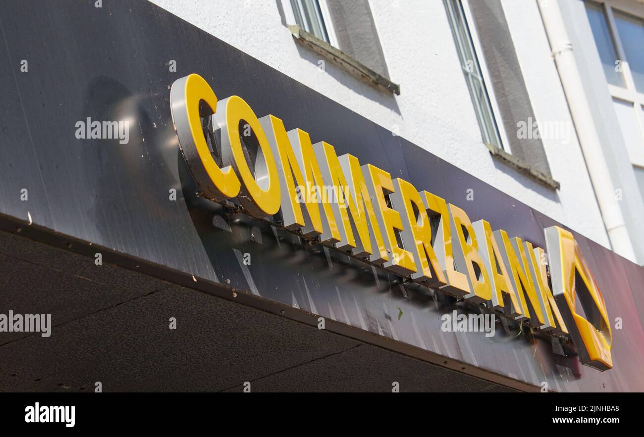 The entrance of the Commerzbank with the yellow logo in Heinsberg, Germany Stock Photo