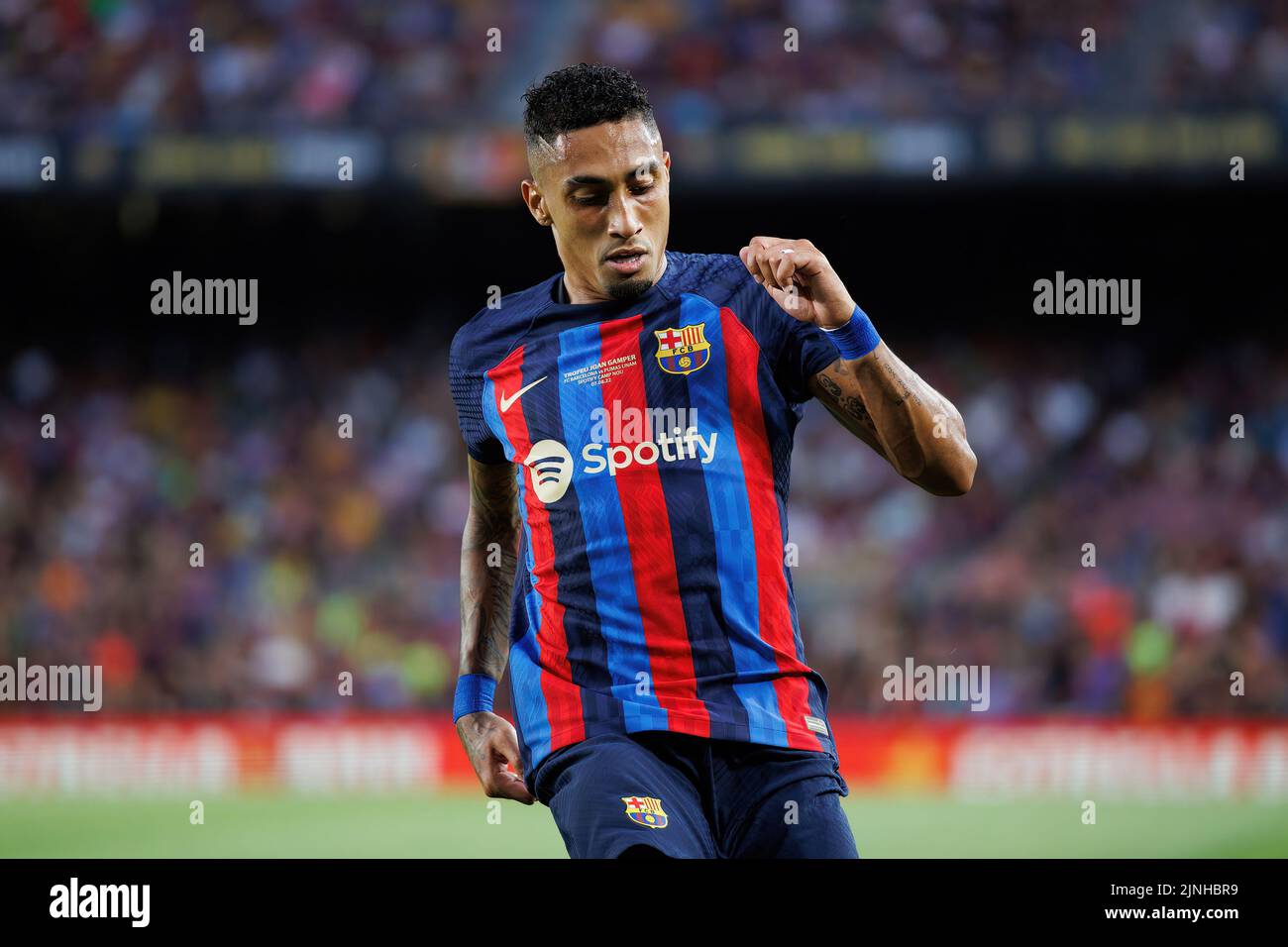 BARCELONA - AUG 7: Raphinha in action during the Joan Gamper Throphy match between FC Barcelona and Pumas at the Camp Nou Stadium on August 7, 2022 in Stock Photo