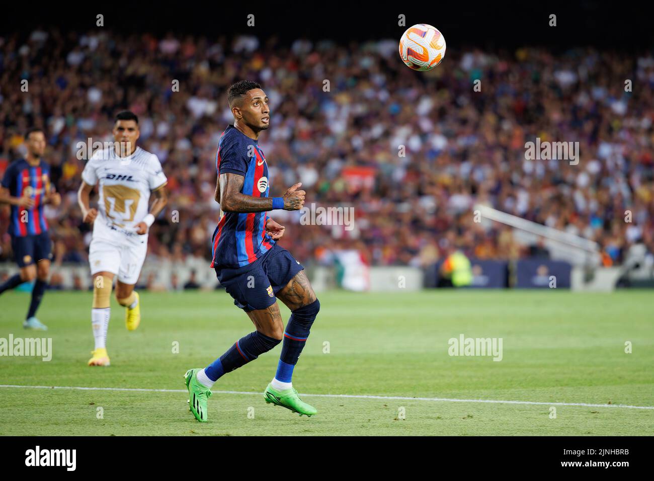 BARCELONA - AUG 7: Raphinha in action during the Joan Gamper Throphy match between FC Barcelona and Pumas at the Camp Nou Stadium on August 7, 2022 in Stock Photo