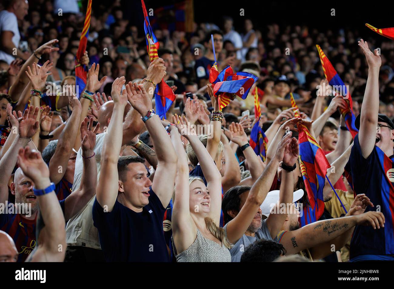 BARCELONA - AUG 7: The fans enjoy during the Joan Gamper Throphy match between FC Barcelona and Pumas at the Camp Nou Stadium on August 7, 2022 in Bar Stock Photo