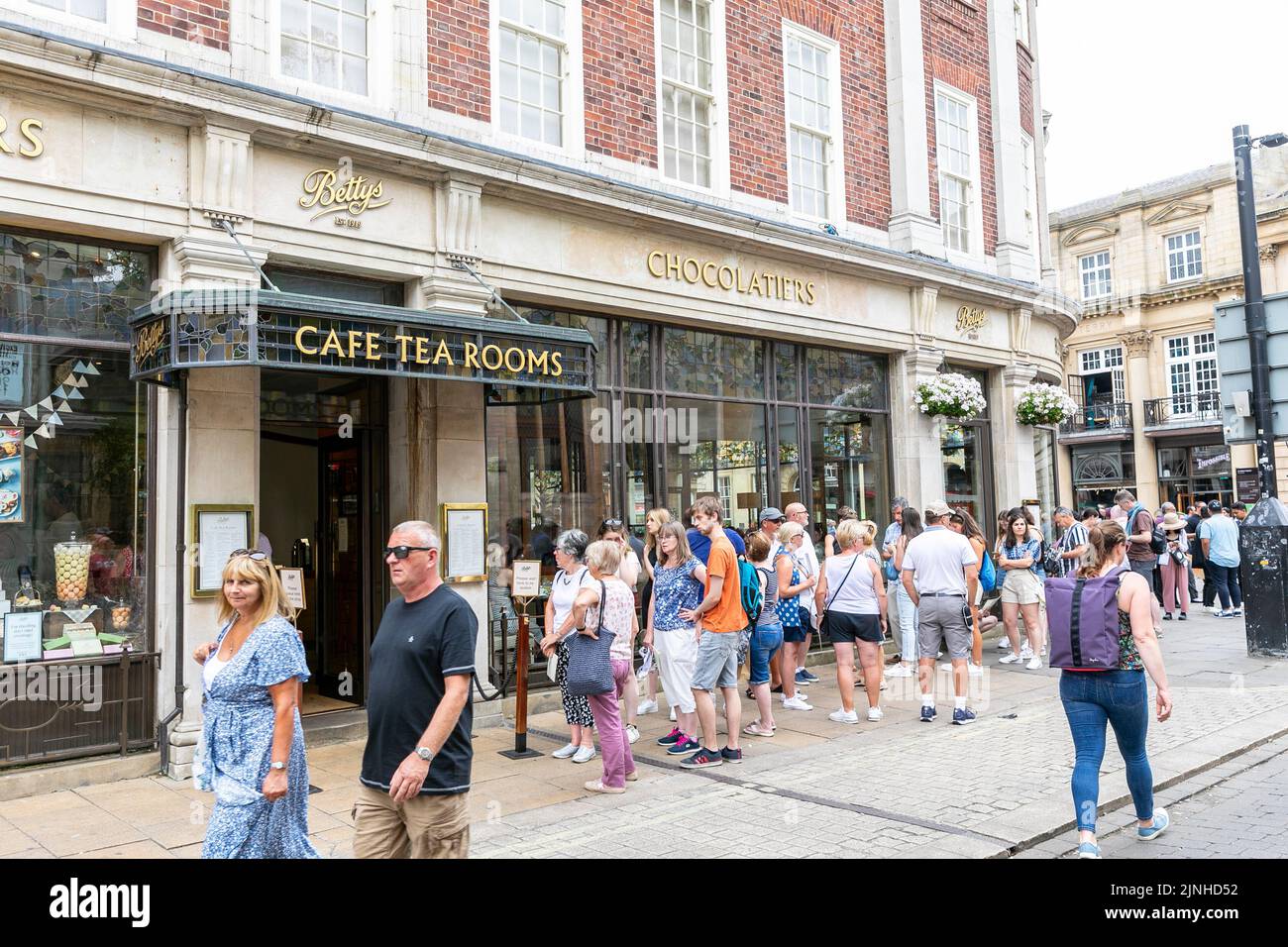 Bettys tea rooms, St Helens Square,City of York, customers queue for
