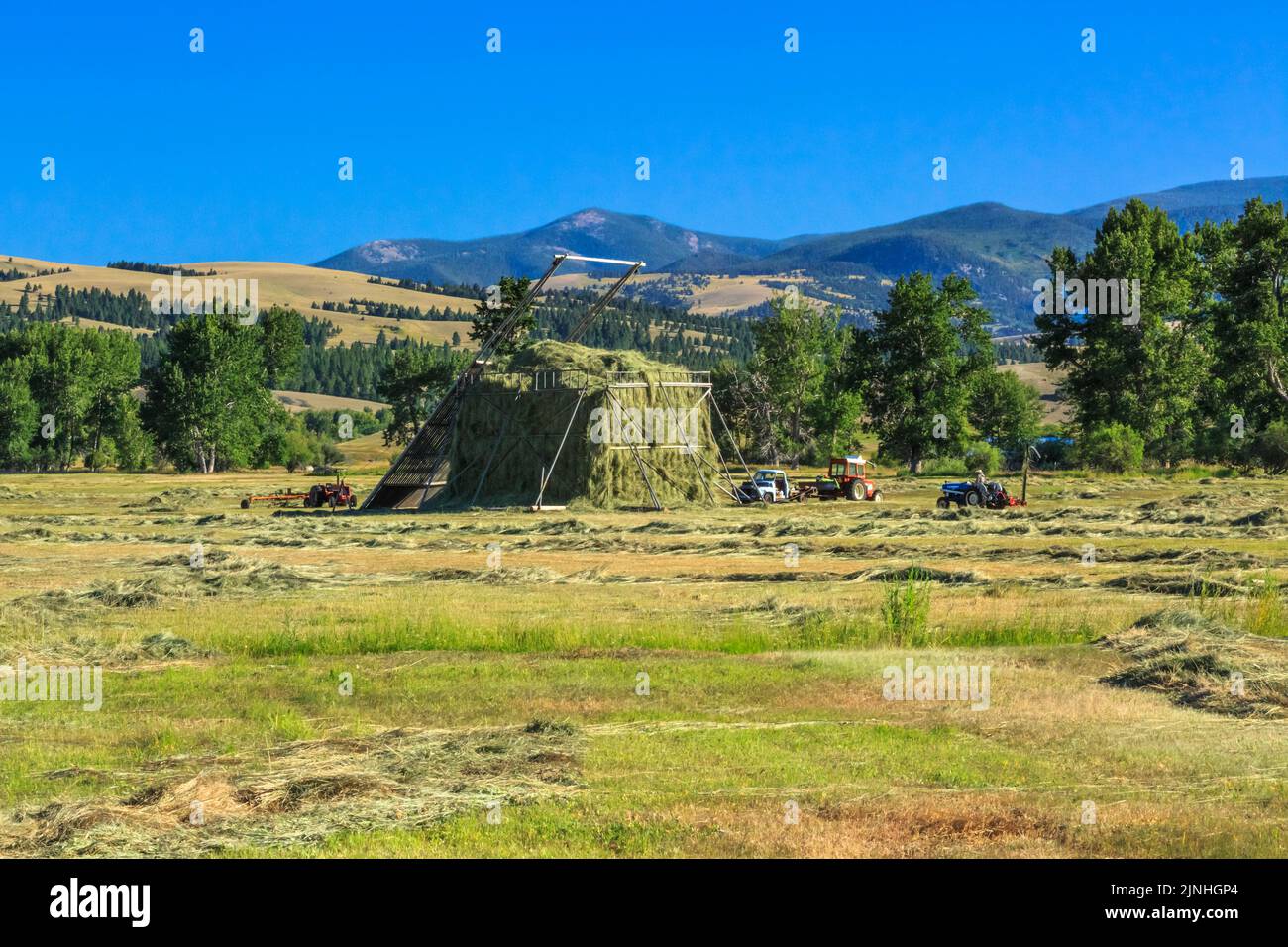 beaverslide haystack and tractors in the avon valley near avon, montana Stock Photo
