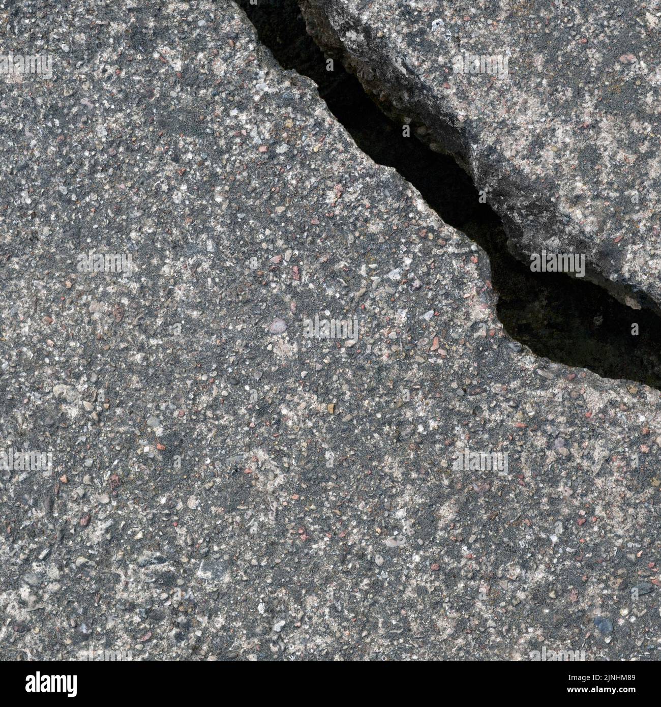 Old aged weathered cracked grey black tarmac texture pattern, large detailed damaged textured asphalt grungy background flat lay, horizontal rough gra Stock Photo