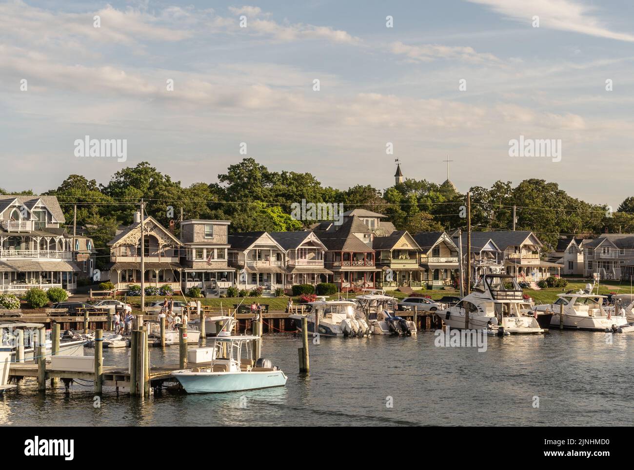 Oaks Bluff, Martha’s Vineyard, Cape Cod, Massachusetts, July 8, 2022:  Row of charming Carpenter Gothic Cottages overlooking the harbor of Oaks Bluff Stock Photo