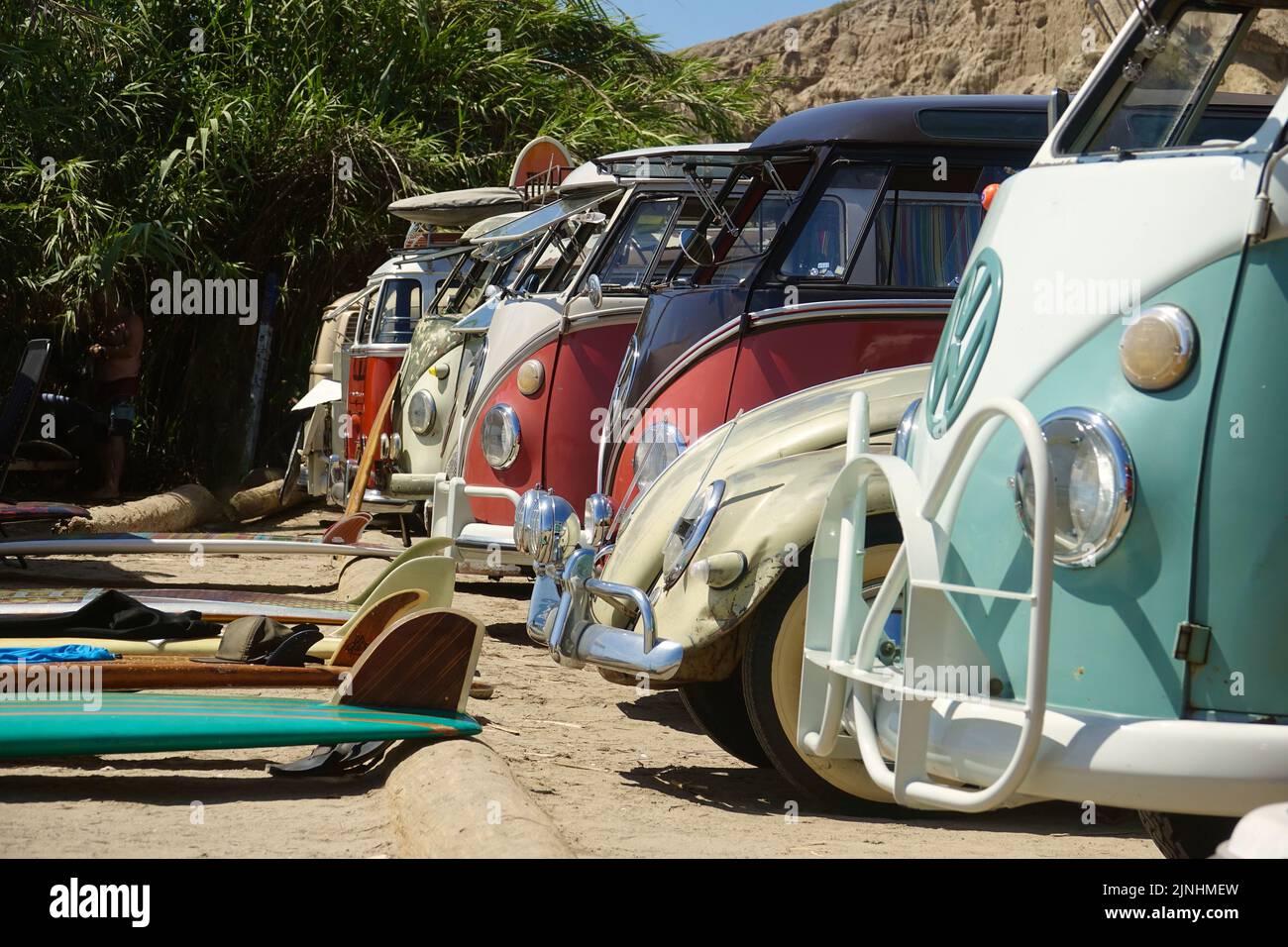 group of vintage VW camper buses at he beach Stock Photo