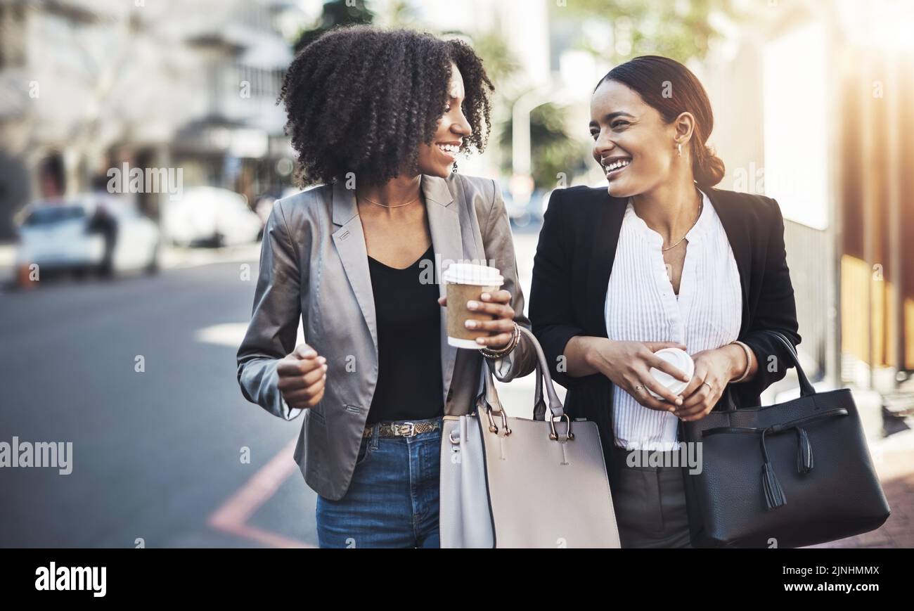 Heading in to the office with absolute optimism. two businesswomen