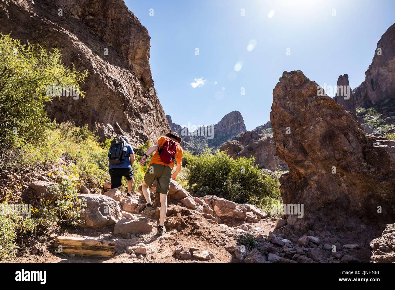 Two men hiking Siphon Draw in Lost Dutchman State Park, Arizona, USA. Stock Photo