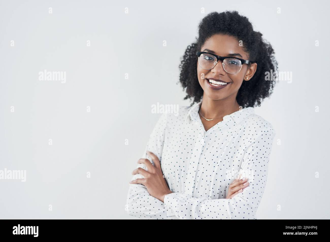 With confidence you can do anything. Studio shot of a confident young businesswoman against a gray background. Stock Photo
