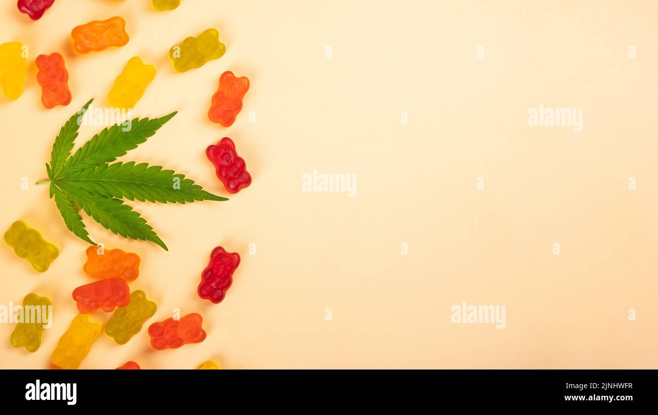 cannabis jelly candy and green leaf with copy space Stock Photo - Alamy