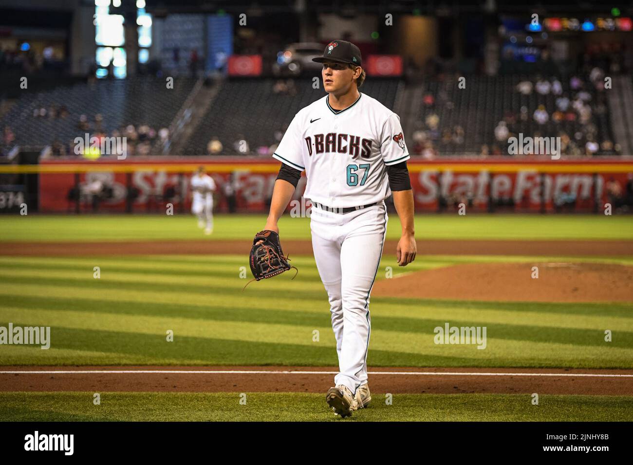 Phoenix, United States. 11th Aug, 2022. Arizona Diamondbacks pitcher Tyler Holton (67) walks off the field after throwing against the Pittsburgh Pirates in the fifth inning during an MLB baseball game, Thursday, August 11, 2022, in Phoenix, Arizona. The Diamondbacks defeated the Pirates 9-3. (Thomas Fernandez/Image of Sport) Photo via Credit: Newscom/Alamy Live News Stock Photo