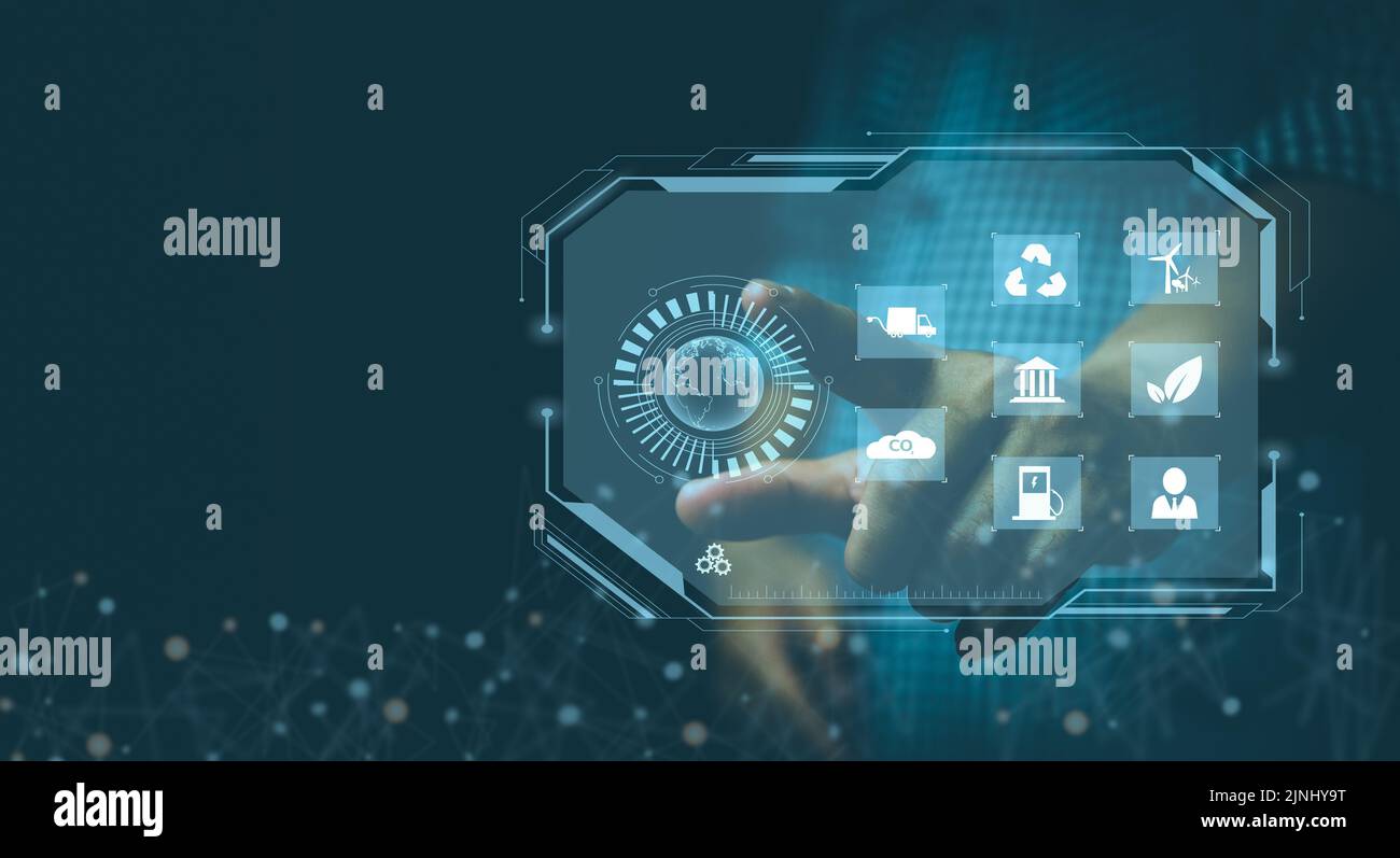 Businessman touching screen virtual icon eco energy sustainable environment digital technology concept. Stock Photo