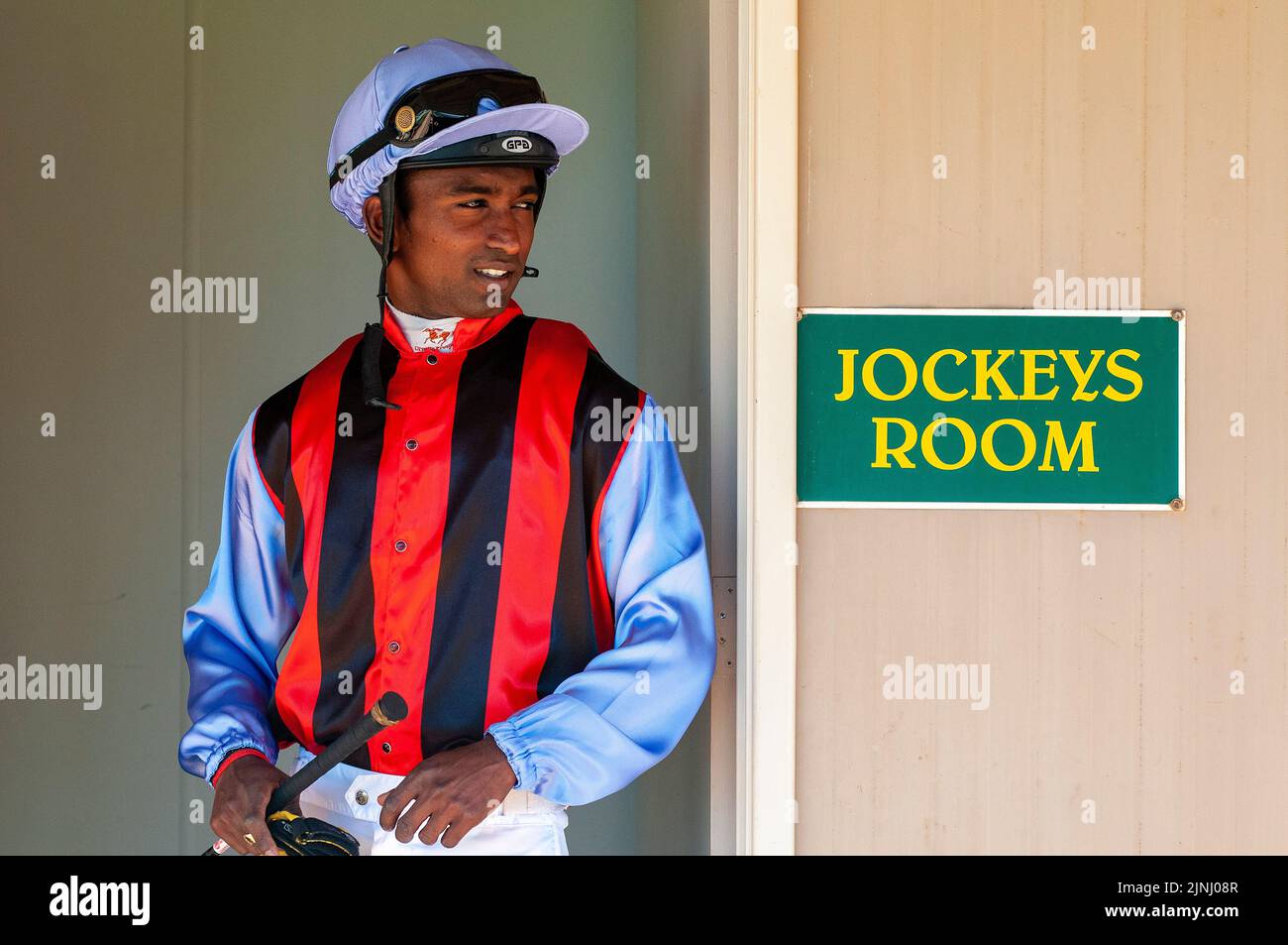 Jockey in silks at a country race meeting at the Kalgoorlie-Boulder Racing Club in Western Australia Stock Photo