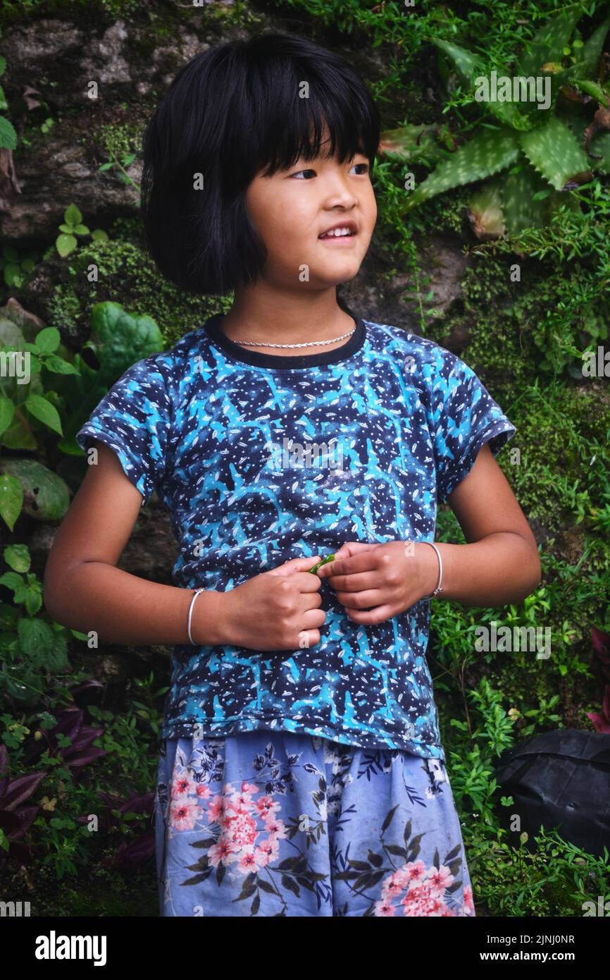 Mirik Lake, Darjeeling district, West Bengal, India - June 20, 2022, Portrait of cute Girl in mountain, Himalayan people, Photo of Kids in their house Stock Photo