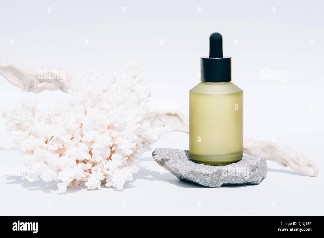 Cosmetic oil with natural Dead Sea minerals in green glass dropper