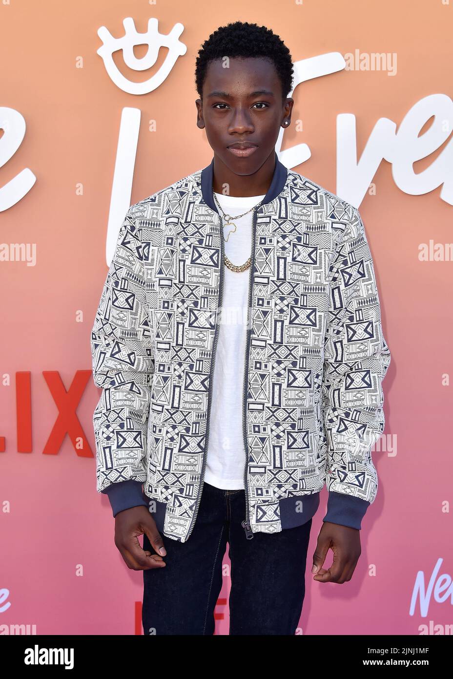 Ramon Reed walking on the red carpet at the Los Angeles premiere of