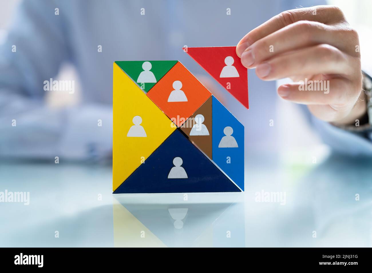 HR Recruitment Hand Making Tangram Puzzle. Talent Management Stock Photo