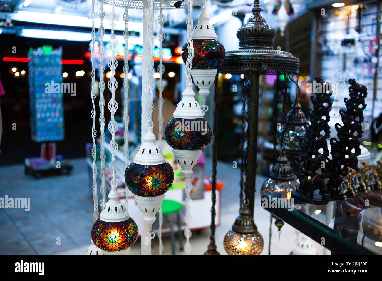 Traditional handmade multicolor Turkish, Moroccan, Arabian lamps. Mosaic style and colored glass lantern. Turkish lamps in souvenir shop in Turkey Stock Photo