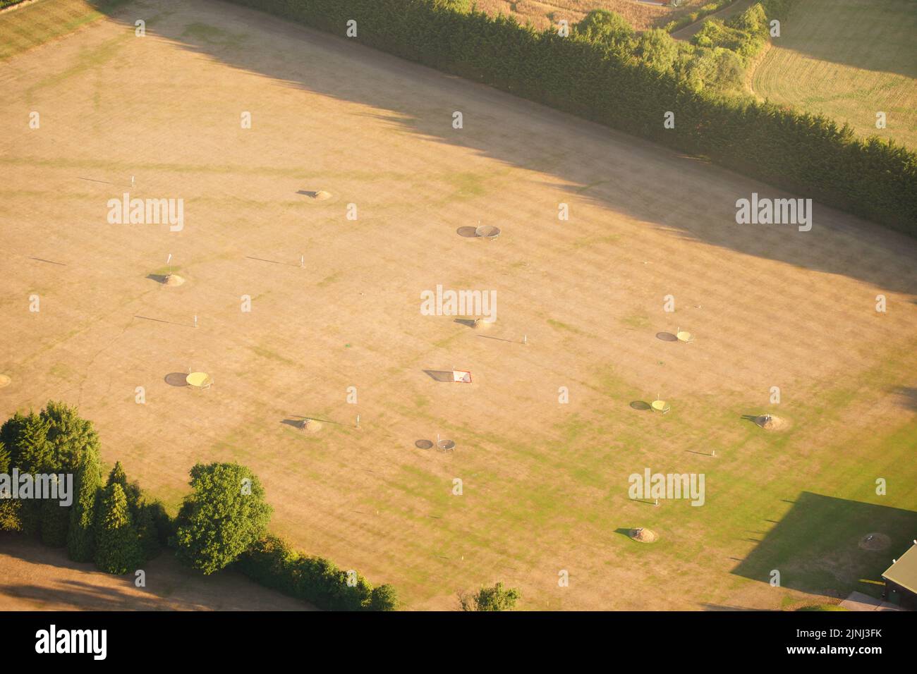 A dried out field near Bristol, where the prolonged dry conditions, have left the parched land turning from green to brown. A drought is set to be declared for some parts of England on Friday, with temperatures to hit 35C making the country hotter than parts of the Caribbean.Picture date: Friday August 12, 2022. Stock Photo