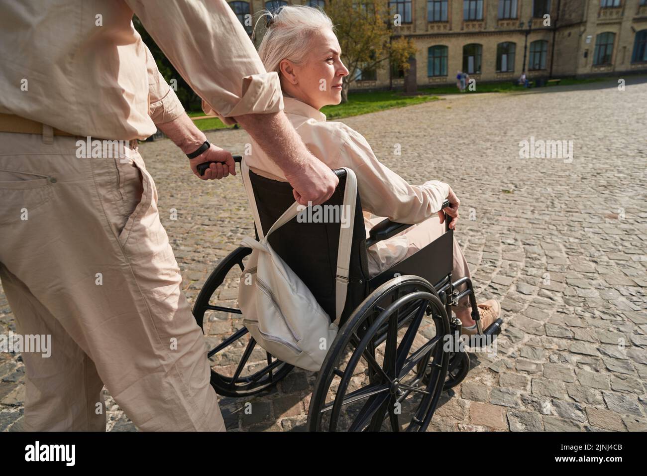 Serious disabled woman sitting in the wheelchair Stock Photo - Alamy