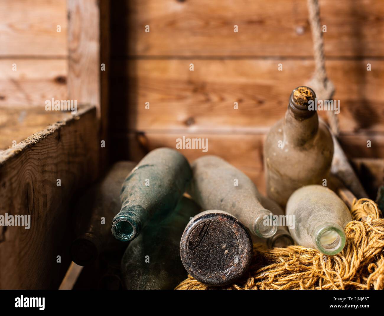 A closeup shot of antique historic bottles in a box Stock Photo