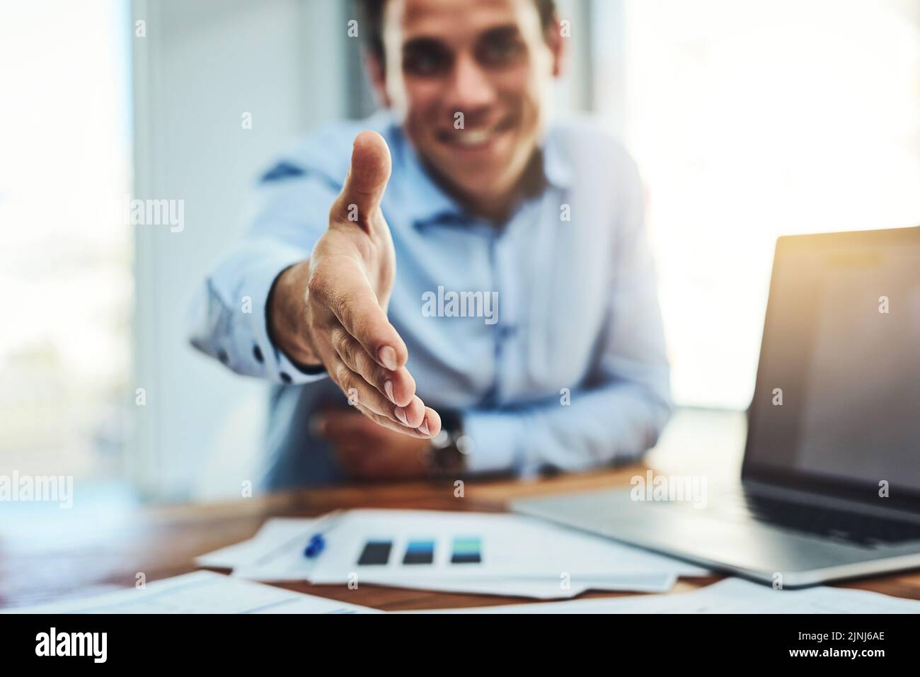 Handshake, deal and hiring HR manager extending his hand to negotiate, introduce or welcome candidate or sponsor. Data analyst, businessman or boss Stock Photo