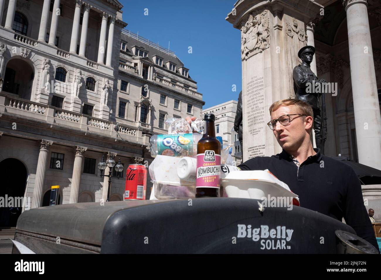 A pile of waste packaging is on the top of a recycling bin outside the Bank of England during the August heatwave in the City of London, the capital's financial district, on 11th August 2022, in London, England. Stock Photo
