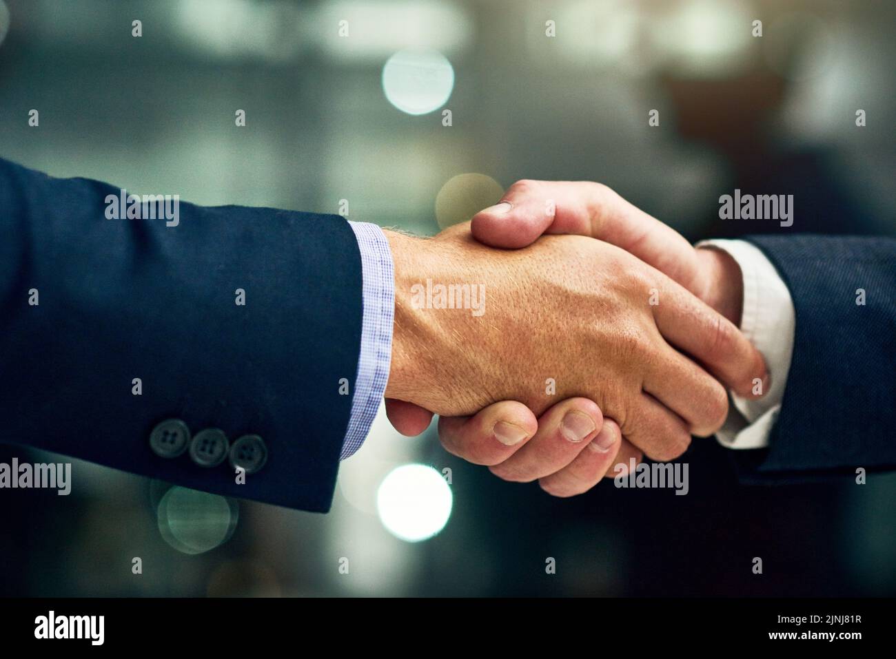 Business people giving handshake, congratulating on success and networking at work. Closeup of a professional corporate manager, boss or ceo hiring Stock Photo