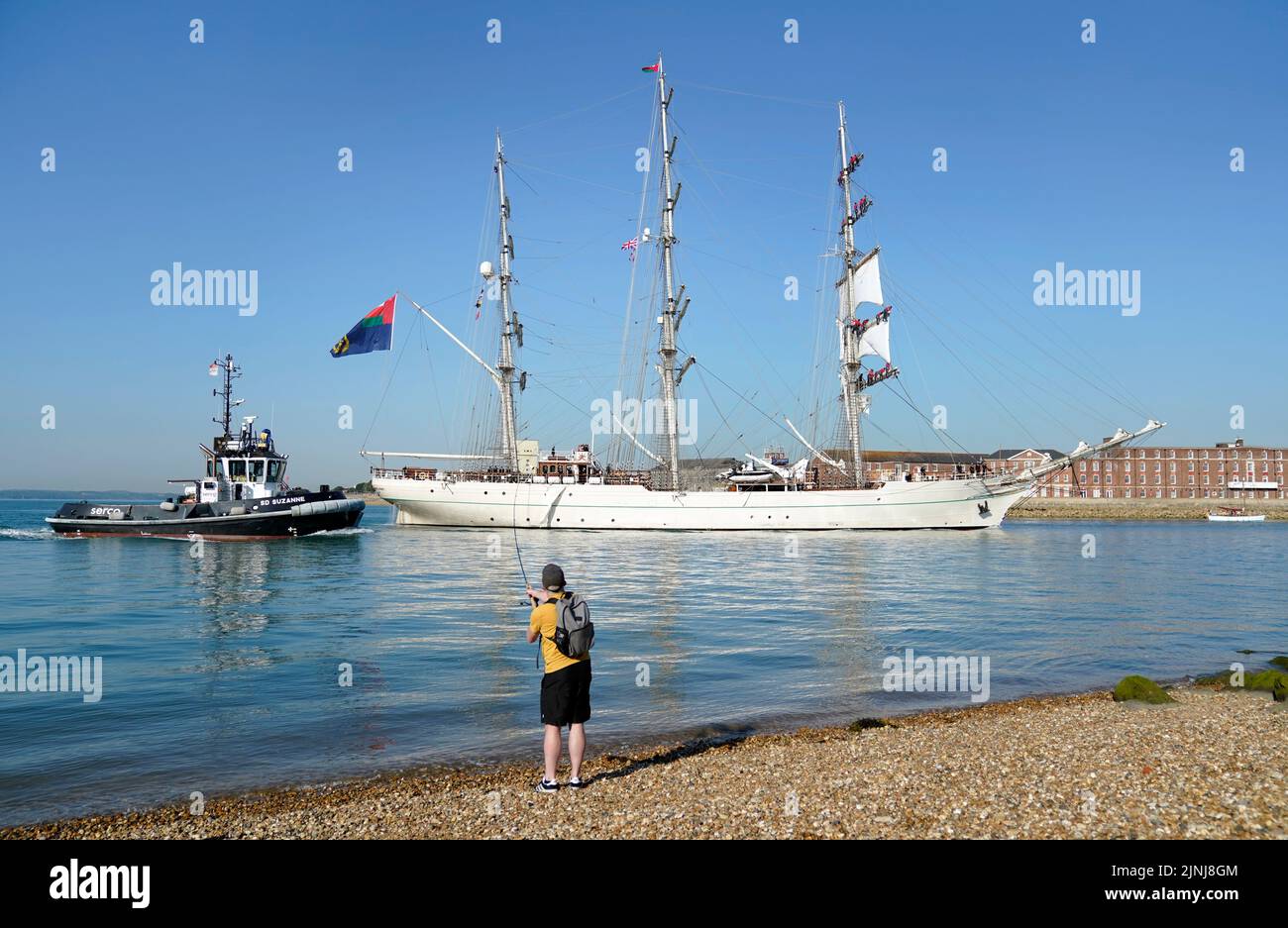 The vessel Shabab Oman II, a full-rigged training ship of the Royal Navy of Oman, arrives into Portsmouth Harbour. The ship is a blend of the traditional and modern with state of the art computerised communication systems and navigation equipment, but from the wooden decking upwards, the ship is traditional in terms of her sails and rigging. Picture date: Friday August 12, 2022. Stock Photo