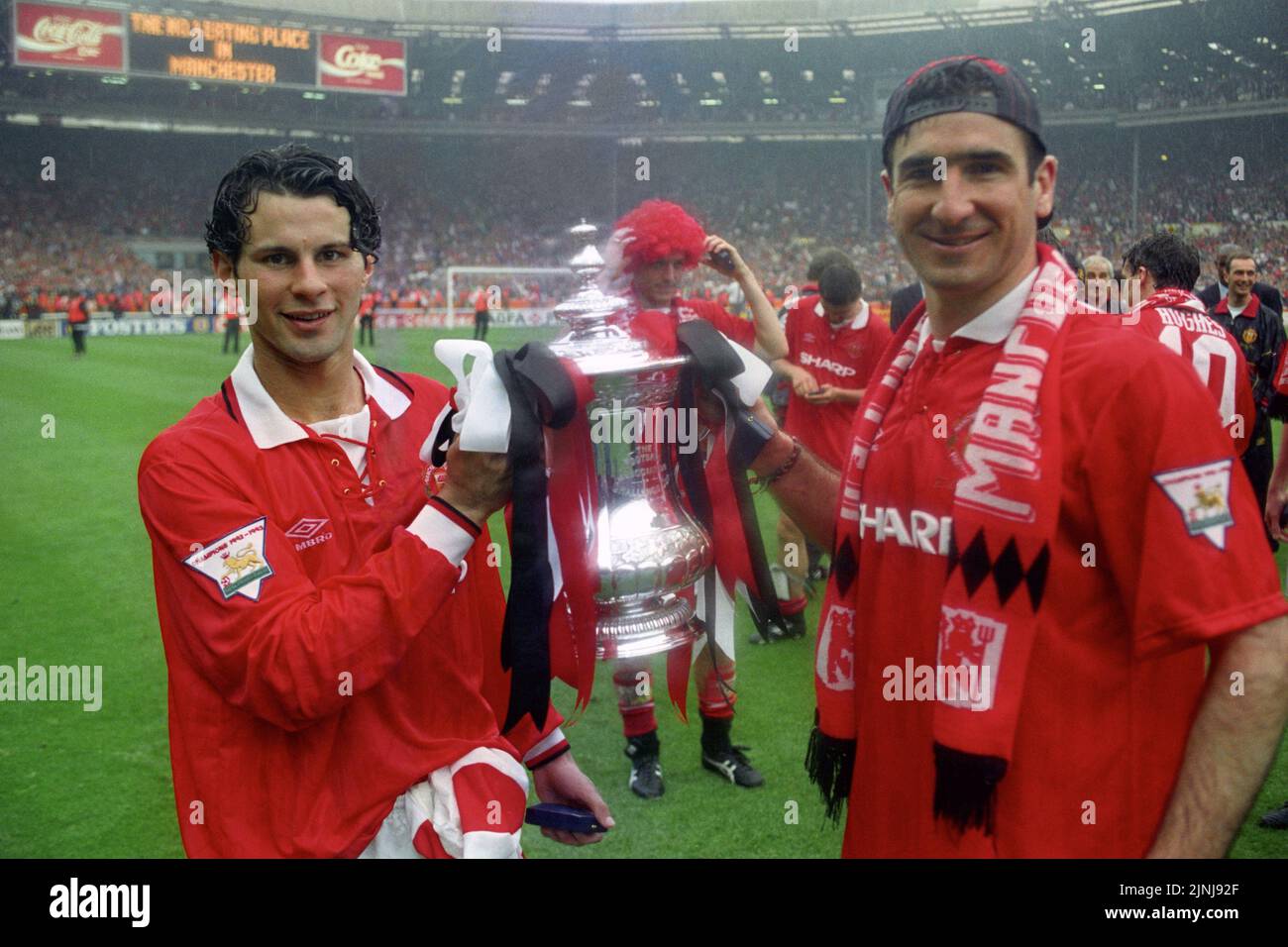 File photo dated 14-05-1994 of Manchester United's Ryan Giggs (left) and Eric Cantona holding the FA Cup after the final against Chelsea, at Wembley. By the end of the following season though, the Blades had been relegated and Manchester United had become back-to-back Premier League champions, adding the 1994 FA Cup for good measure. Issue date: Friday August 12, 2022. Stock Photo