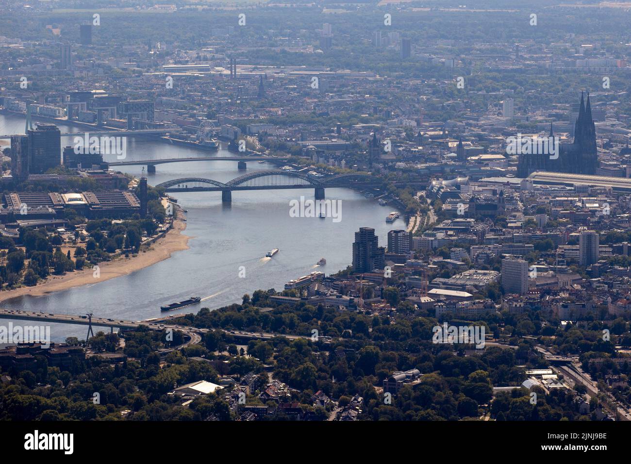 Cologne, Germany. 11th Aug, 2022. Ships with little cargo sail on the