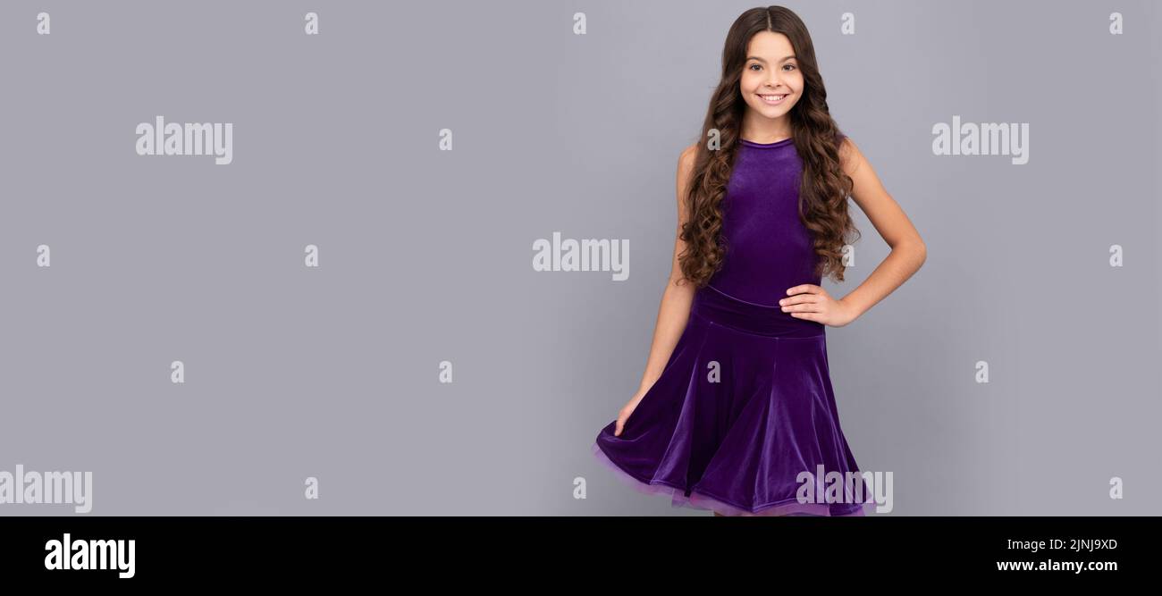 child in purple dance dress. dancing school. Child face, horizontal poster, teenager girl isolated portrait, banner with copy space. Stock Photo
