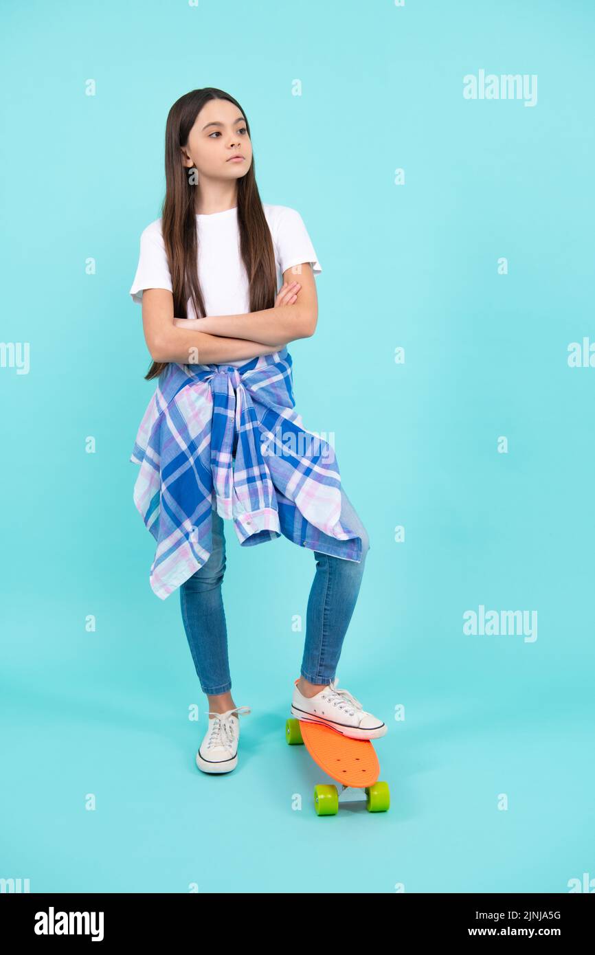 Studio shot of trendy teenage fashion model in casual look. Teenager
