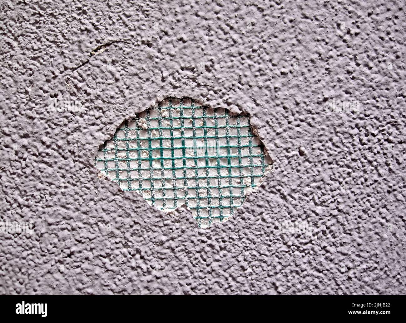 damaged part of the abstract uneven concrete stone wall surface