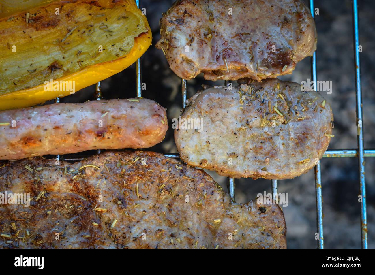 barbecue with pork and peppers that cook slowly with no flame and a