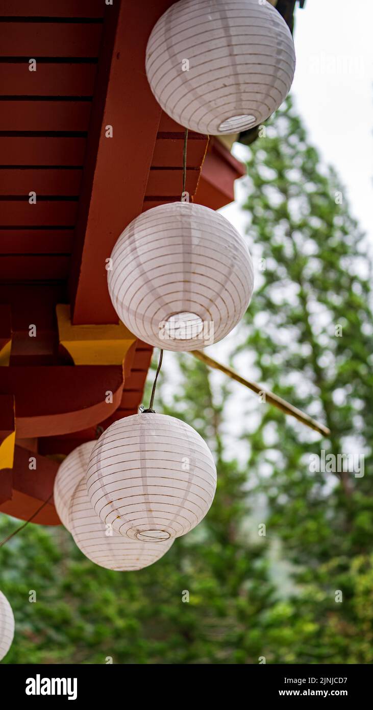 A vertical shot of Chinese lantern hanging from the roof outdoors Stock ...