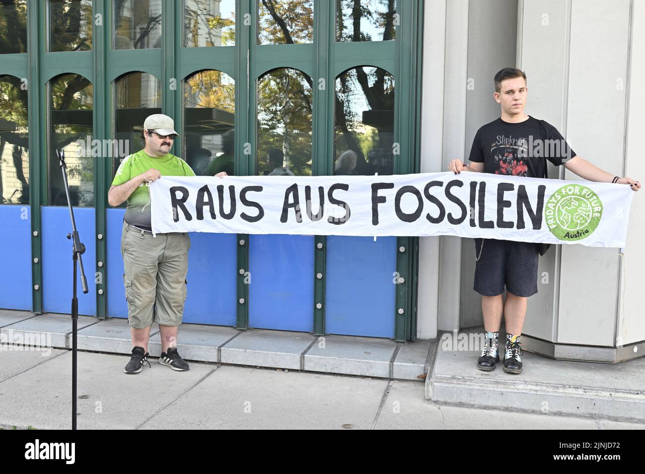 Vienna, Austria. 12th Aug, 2022. Fridays for Future protest in front of the Climate Ministry in Vienna. Picture shows a banner with the inscription 'Get out of the fossils'. Credit: Franz Perc/Alamy Live News Stock Photo
