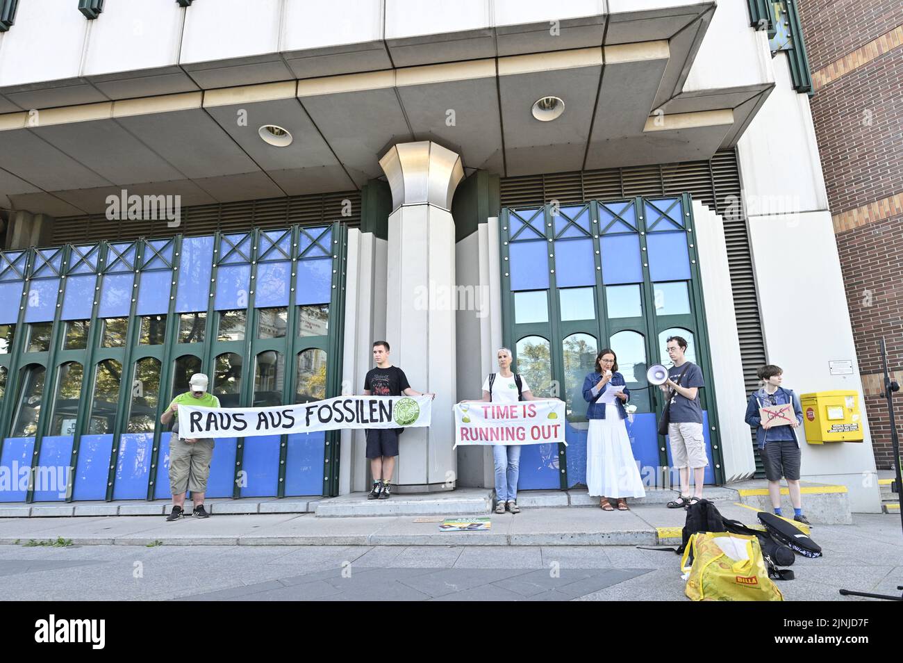 Vienna, Austria. 12th Aug, 2022. Fridays for Future protest in front of the Climate Ministry in Vienna. Picture shows a banner with the inscription 'Get out of the fossils'. Credit: Franz Perc/Alamy Live News Stock Photo