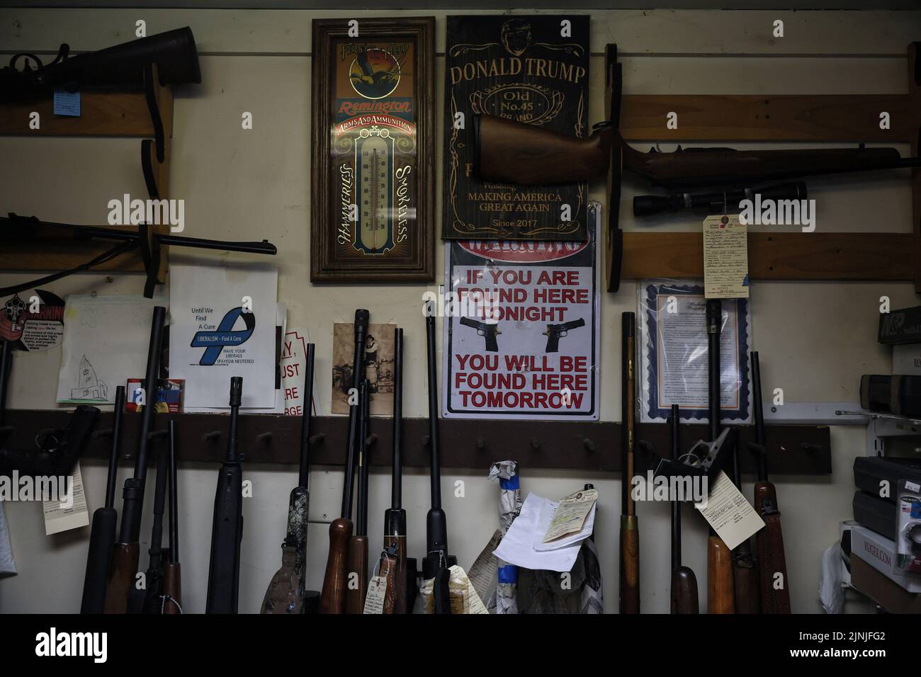 Guns are seen on display at The Gun Shop at MacGregor's in Lake Luzerne, New York, U.S., July 19, 2022. REUTERS/Shannon Stapleton Stock Photo