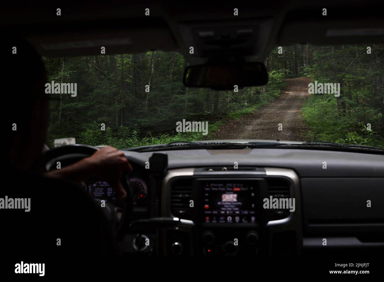 Rick Bennett drives off of New York State Route 28N to the Moose Pond Club near Minerva, New York, U.S., July 20, 2022. REUTERS/Shannon Stapleton Stock Photo