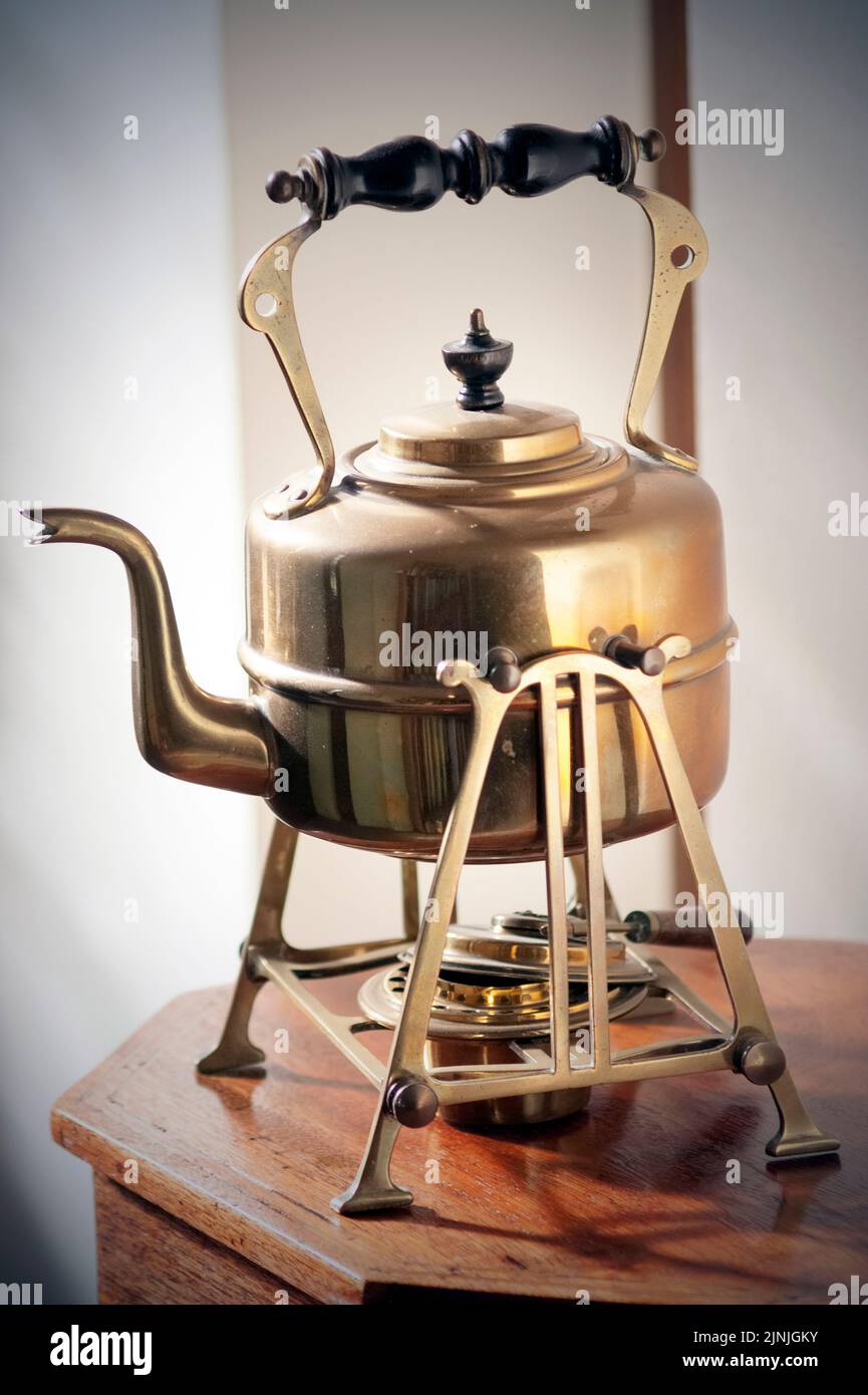 antique copper kettle on stand Stock Photo - Alamy