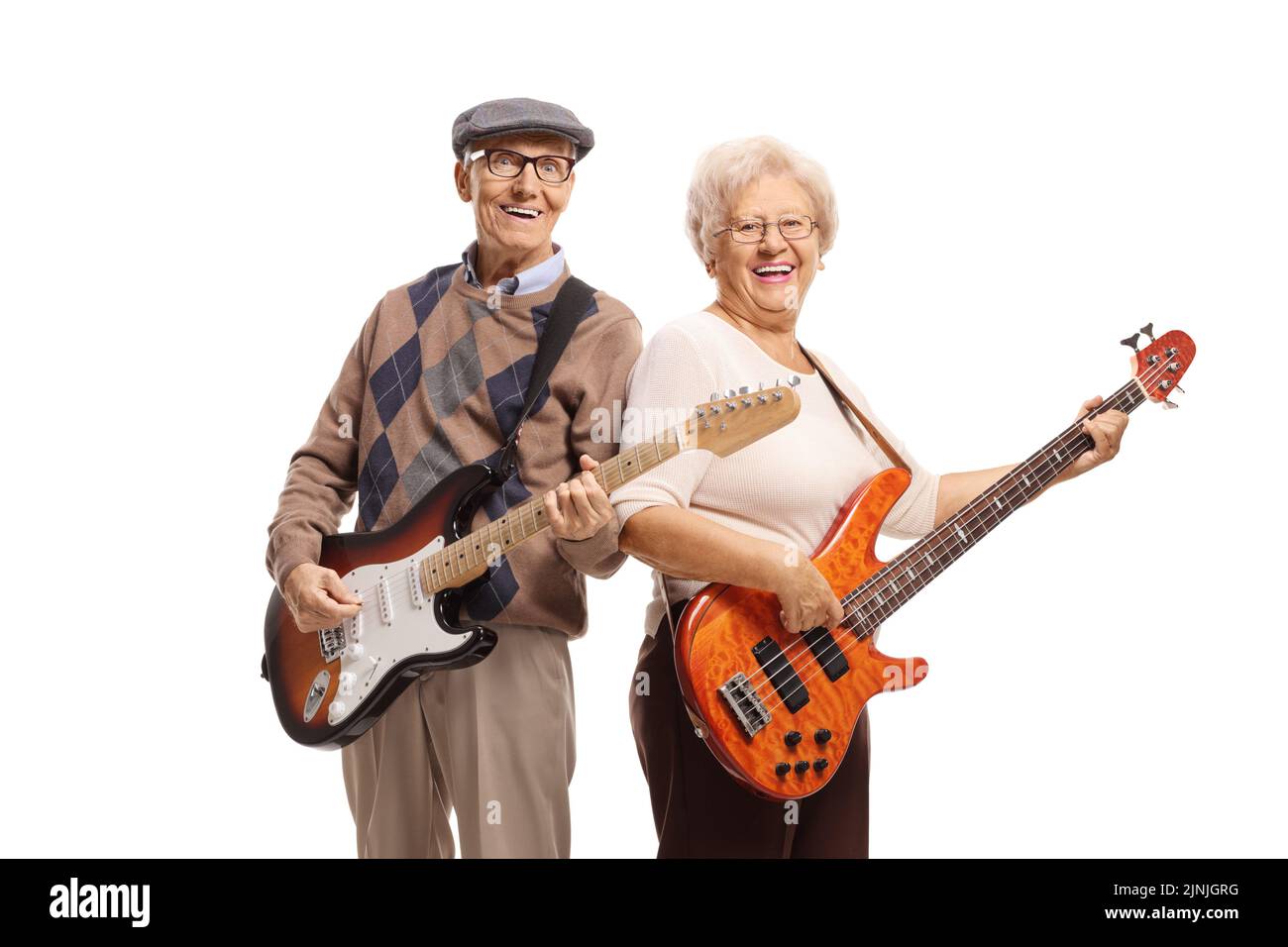 Elderly man and woman playing electric guitars and smiling isolated on white background Stock Photo
