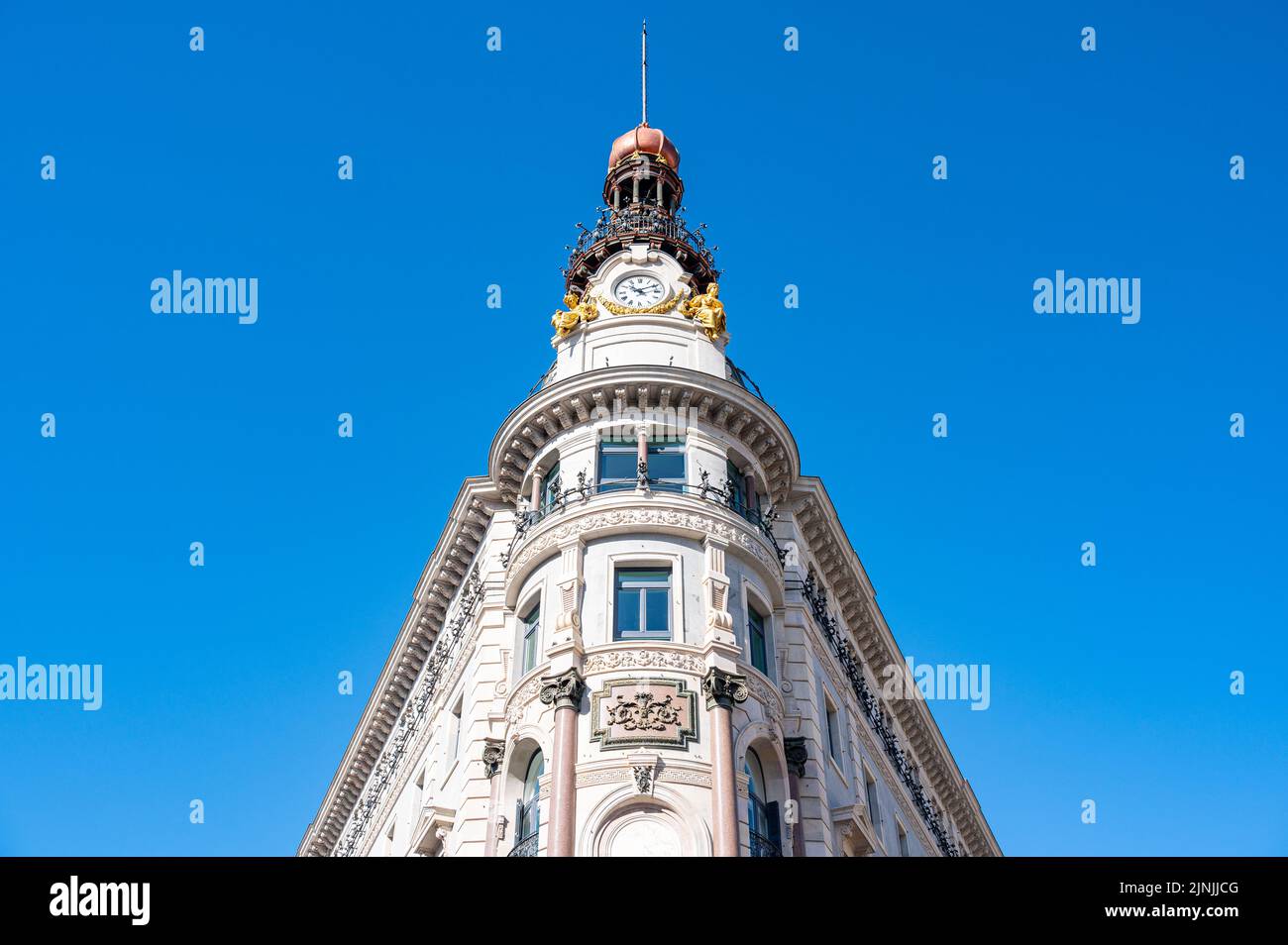 Architecture of the Four Seasons Hotel And Private Residences. Low angle view of the clock tower. Stock Photo