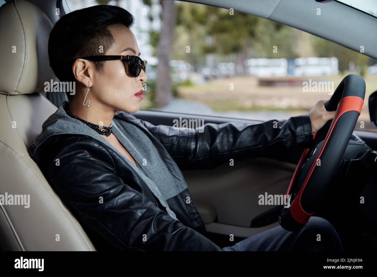 Asian woman in leather jacket hi-res stock photography and images - Alamy