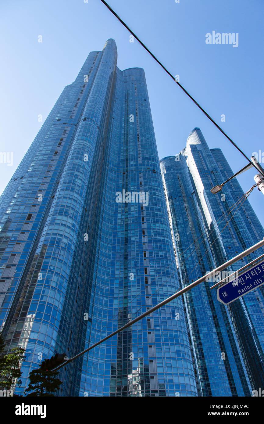 A modern skyscraper against a blue clear sky in Busan South Korea Stock Photo
