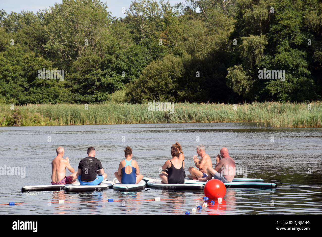 Latitude Festival July 2022, Henham Park, Suffolk, UK. Yoga on paddleboards in the lake Stock Photo