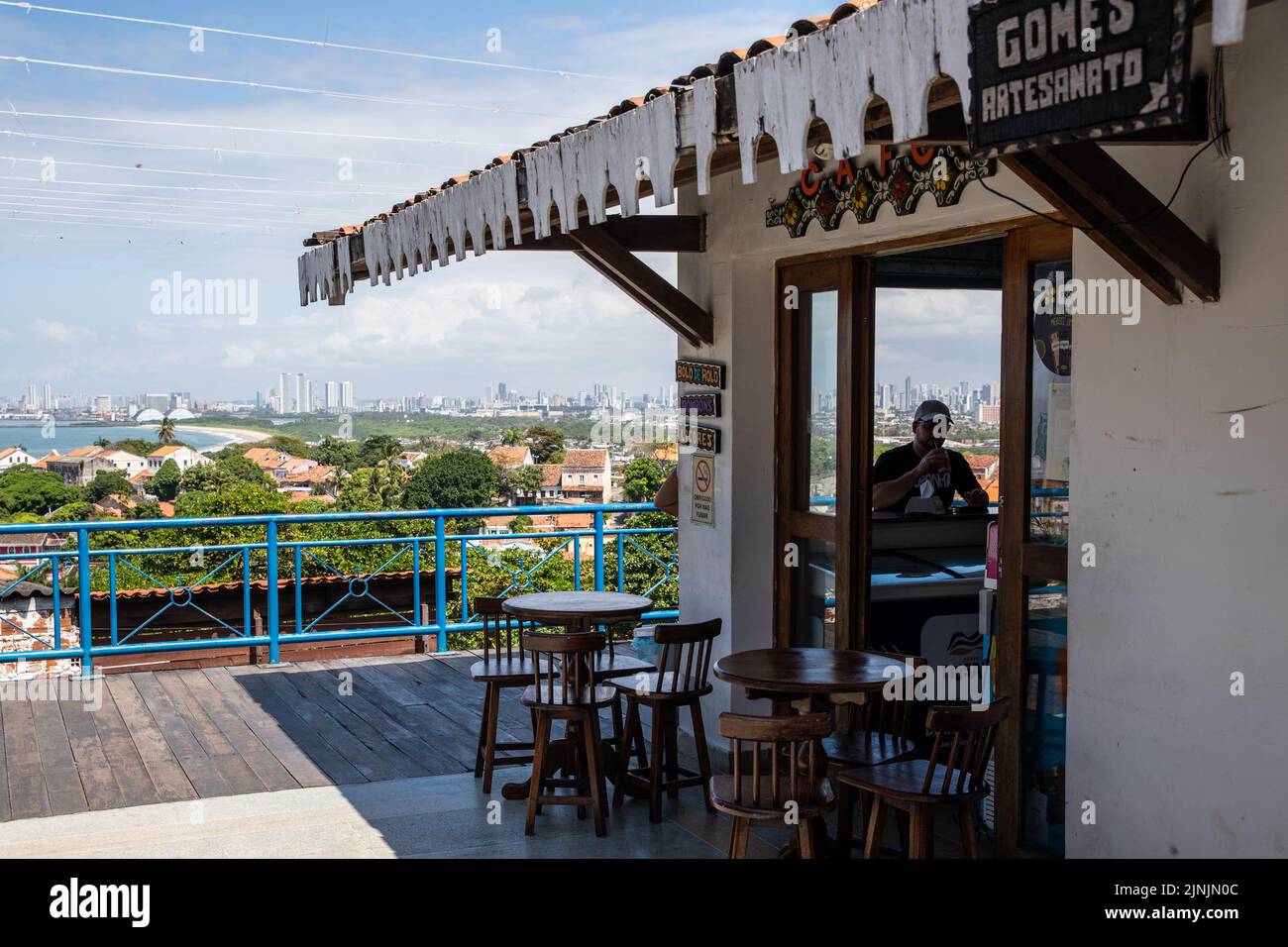 Olinda, Brazil. 11th Aug, 2022. A tourist drinks beverage at a restaurant in Olinda, Brazil, Aug. 11, 2022. The Historic Centre of the Town of Olinda was inscribed on the UNESCO World Heritage List in 1982. Credit: Wang Tiancong/Xinhua/Alamy Live News Stock Photo