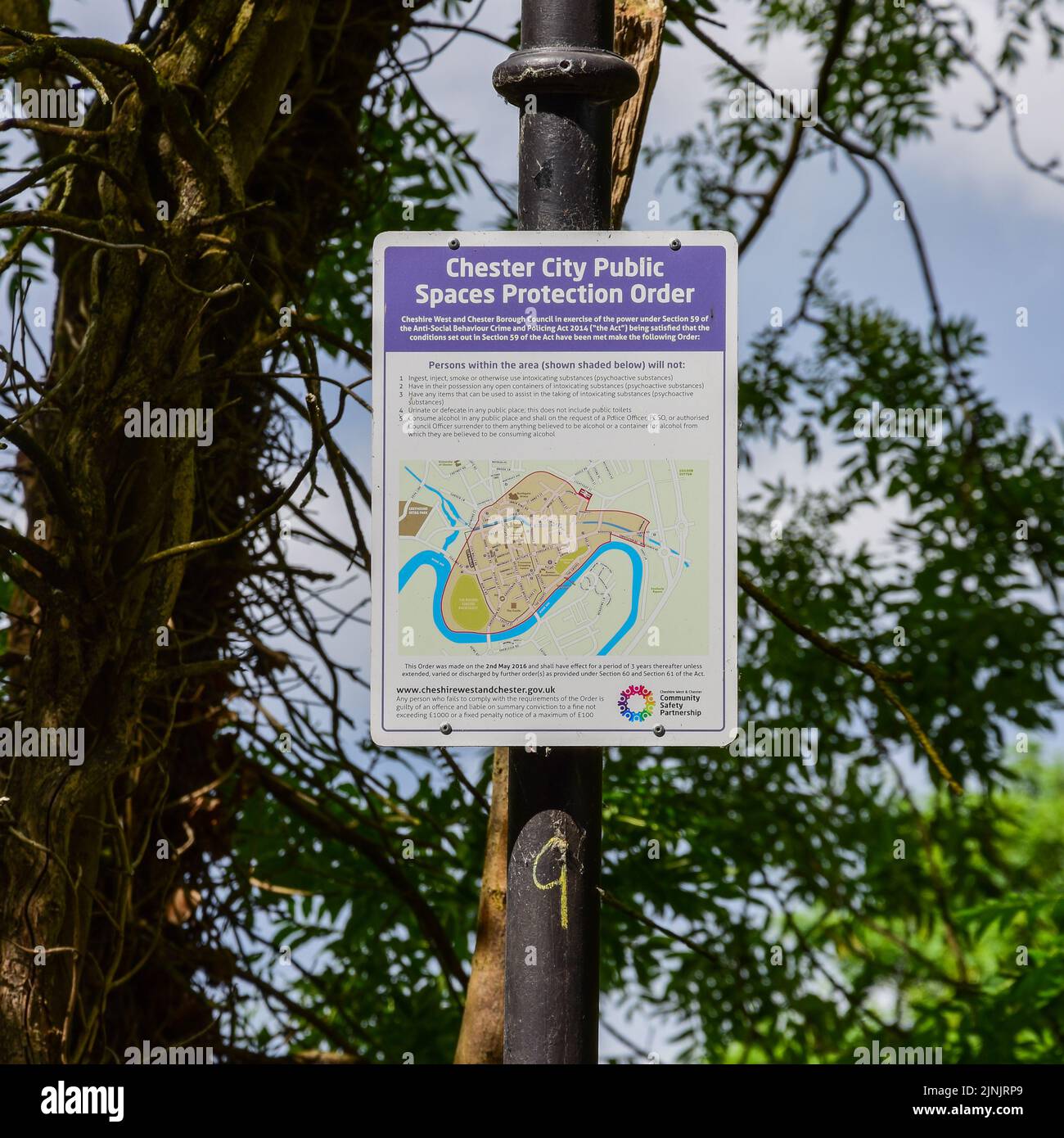 Chester, UK: Jul 3, 2022: A sign displayed on the City Walls Road contains information about the Chester city centre spaces protection order along wit Stock Photo