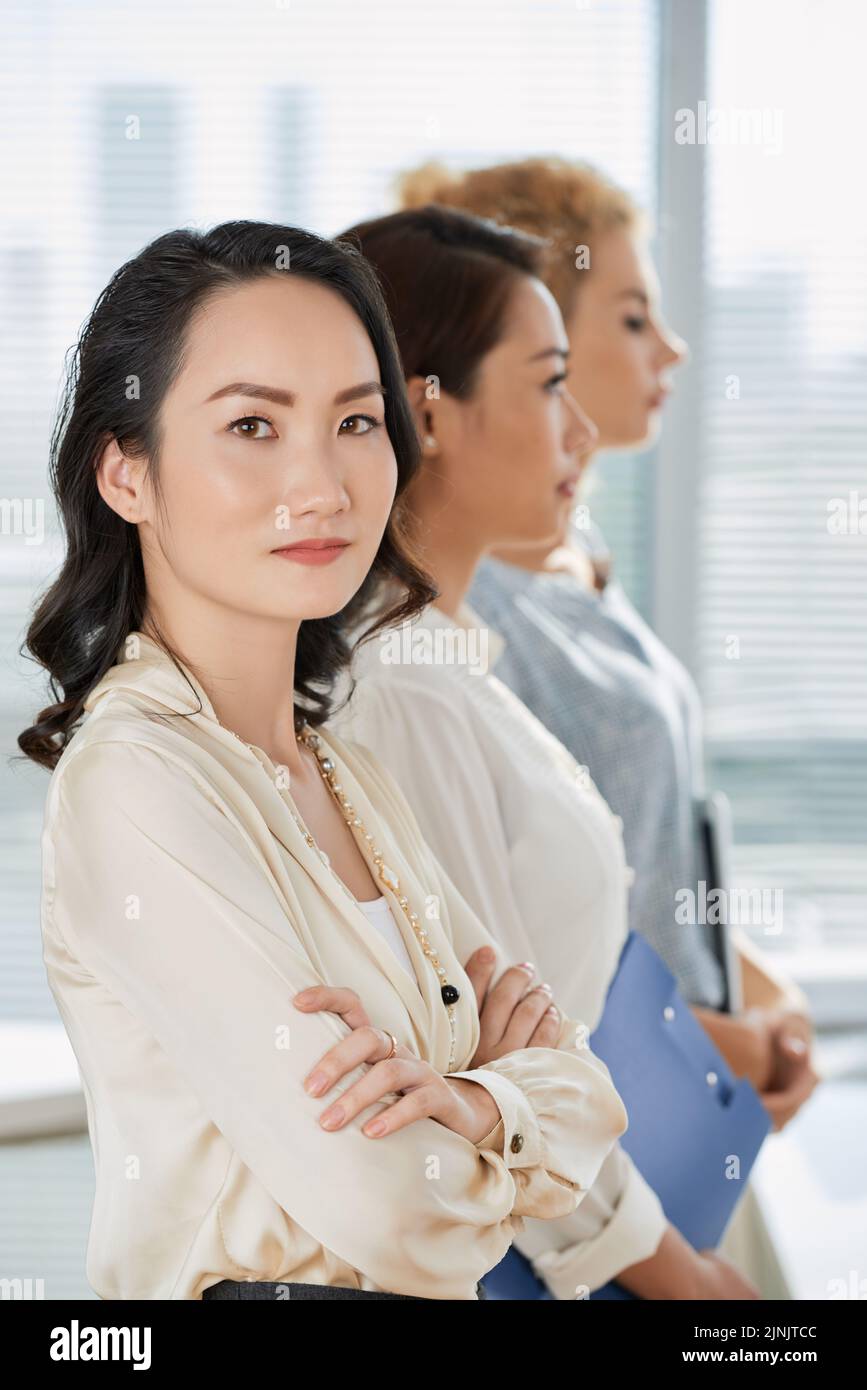 Portrait of confident pretty business lady standing her arms crossed Stock Photo Alamy