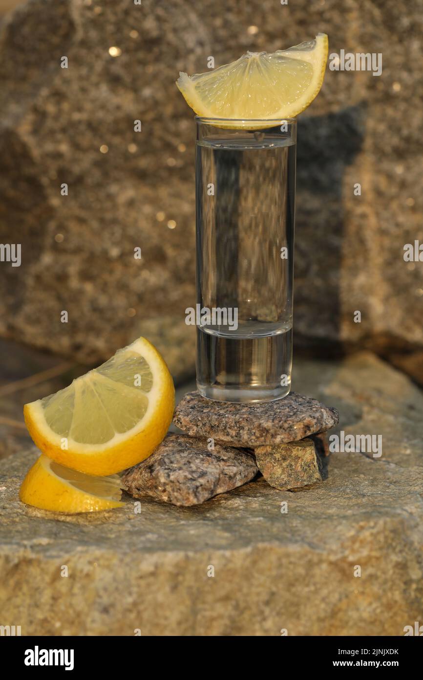 glass of alcohol drink with stone background Stock Photo Alamy